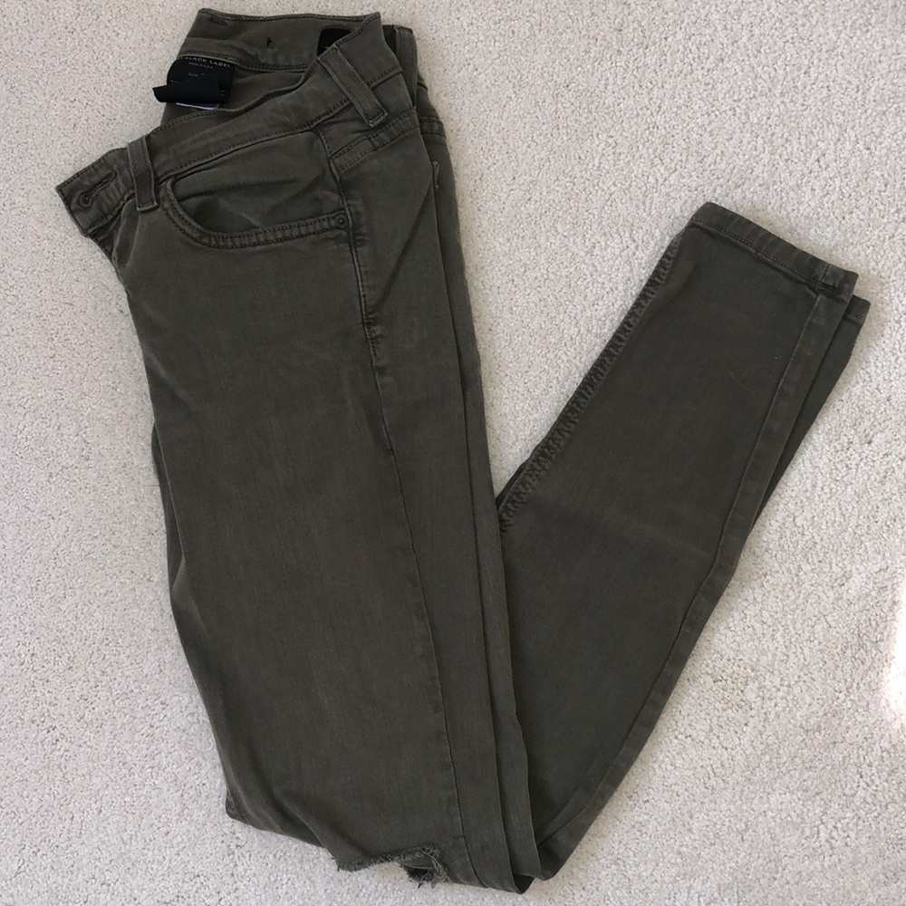 Olive green stretchy skinny jeans.